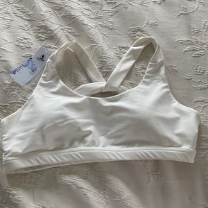 White cross-back sports bra.